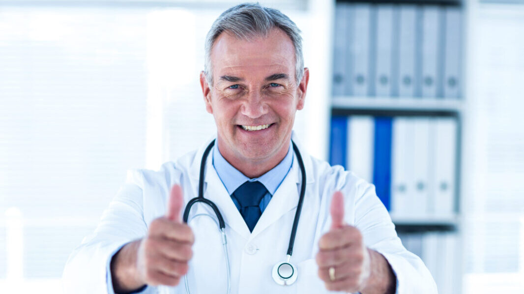 Doctor smiling and giving thumbs up to signify he is very happy with his chronic care management program